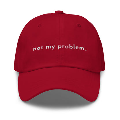 not-my-problem-classic-dad-cap in  Classic dad cap with embroidered witty quote – Stay Witty classic baseball hat with adjustable strap and curved brim.