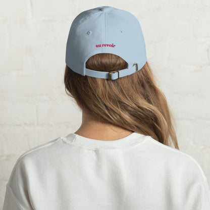 bonjour-au-revoir-classic-dad-cap in Stone Classic dad cap with embroidered witty quote – Stay Witty classic baseball hat with adjustable strap and curved brim.