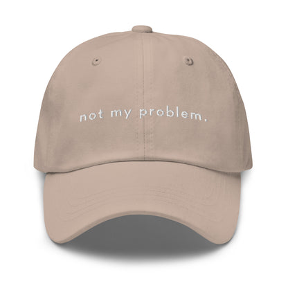 not-my-problem-classic-dad-cap in  Classic dad cap with embroidered witty quote – Stay Witty classic baseball hat with adjustable strap and curved brim.